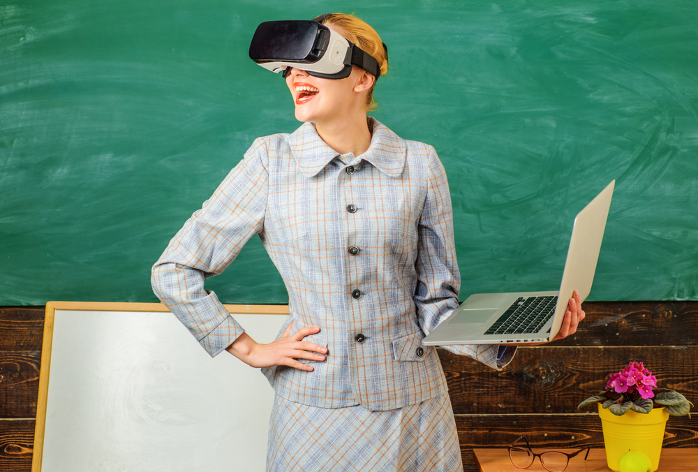 Smiling,Teacher,With,Laptop,In,Vr,Headset.,Digital,Education.,Modern